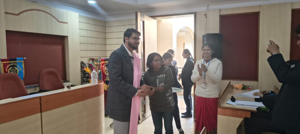 Shantanu Tarey being felicitated with honors for his remarkable contribution as an AI and Digital Marketing Expert, Founder & CEO of The DigitalFlix, during the Digital Security and Hygiene Workshop at Sant Hirdaram Girls College, Bhopal.
