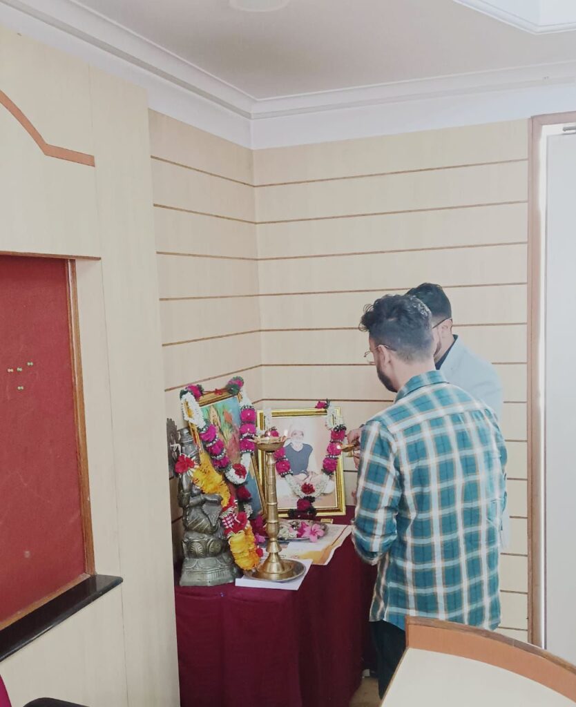 Shantanu Tarey performing traditional lamp lighting ceremony at Sant Hirdaram Girls College, marking the inauguration of an AI and Digital Marketing education initiative powered by The DigitalFlix Solutions Private Limited